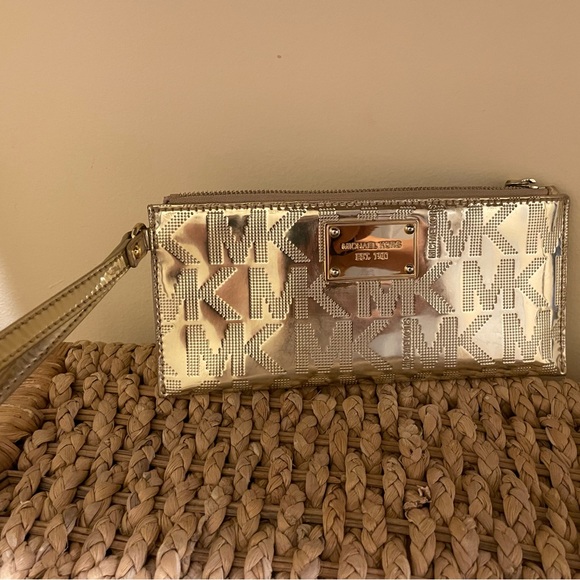 Michael Kors gold metallic MK print wristlet. - Picture 2 of 5